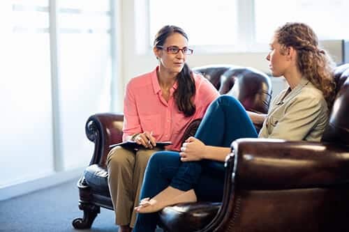 What is psychotherapy? This patient with her counselor is finding out.