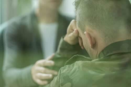 A counselor offers sympathy while discussing the relationship between veterans and addiction