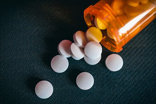 An emptied pill bottle illustrates Klonopin addiction