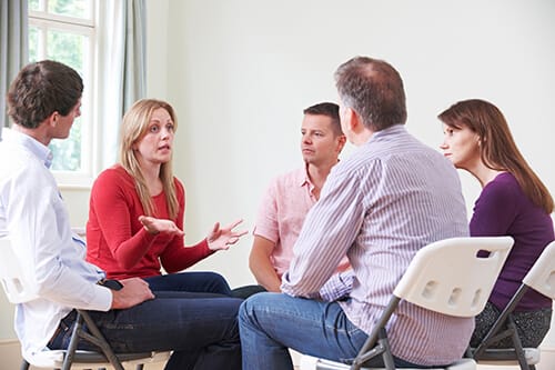 An addiction recovery group in session 