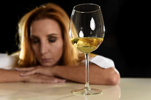a woman in need of alcoholic rehab for her dependence