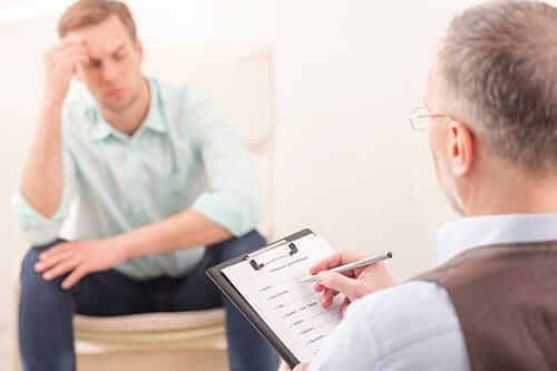 man discussing panic disorder treatment in pa with his doctor