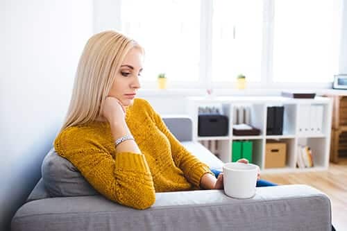 woman pondering the differences between detox vs rehab