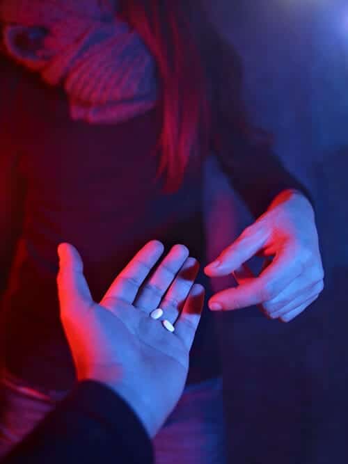 party drugs being shared at a party