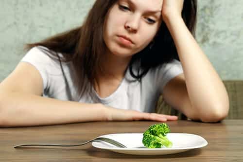 young woman wondering what is disordered eating