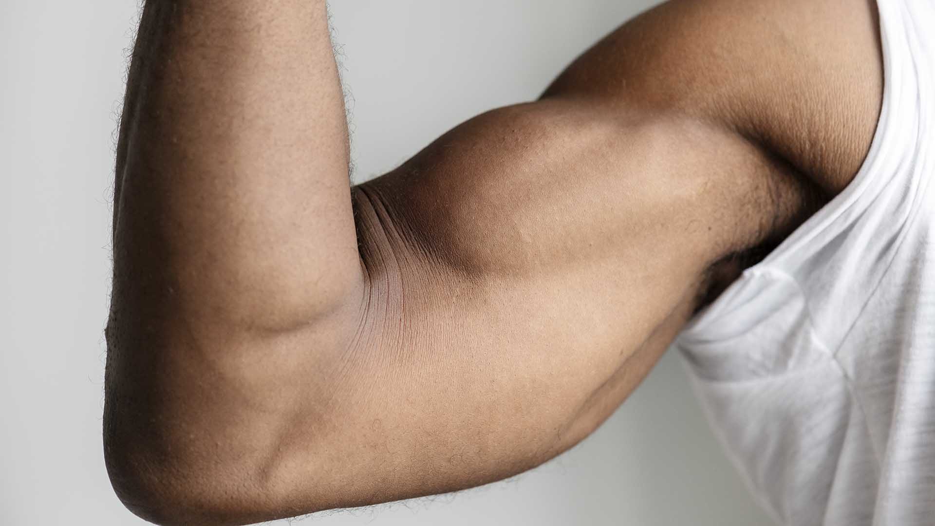 Closeup of a man flexing his muscle