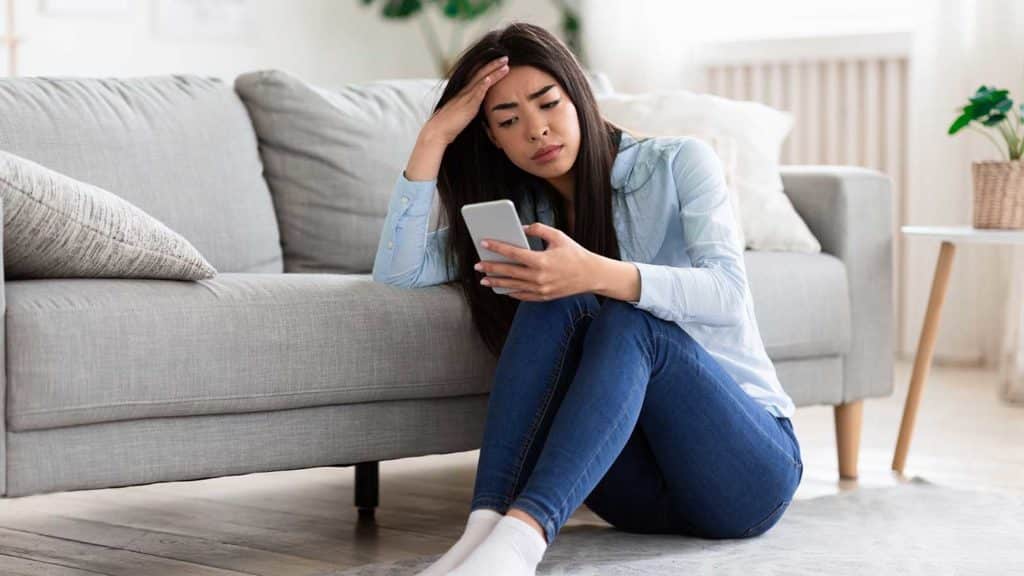 women with codependency issues waiting for a text message