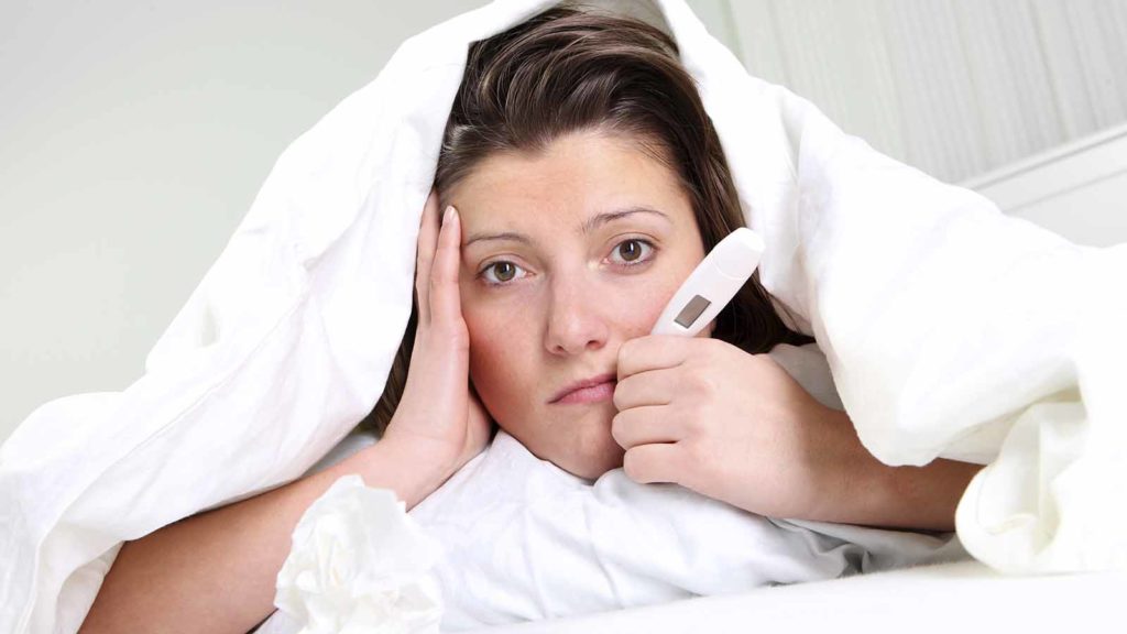 woman-checking-temperature-for-a-fever