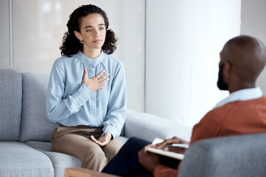 Young woman speaking to her therapist